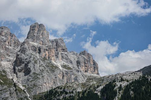 Free Majestic mountain peaks rise under a partly cloudy sky, showcasing rugged natural beauty and remote wilderness. Stock Photo
