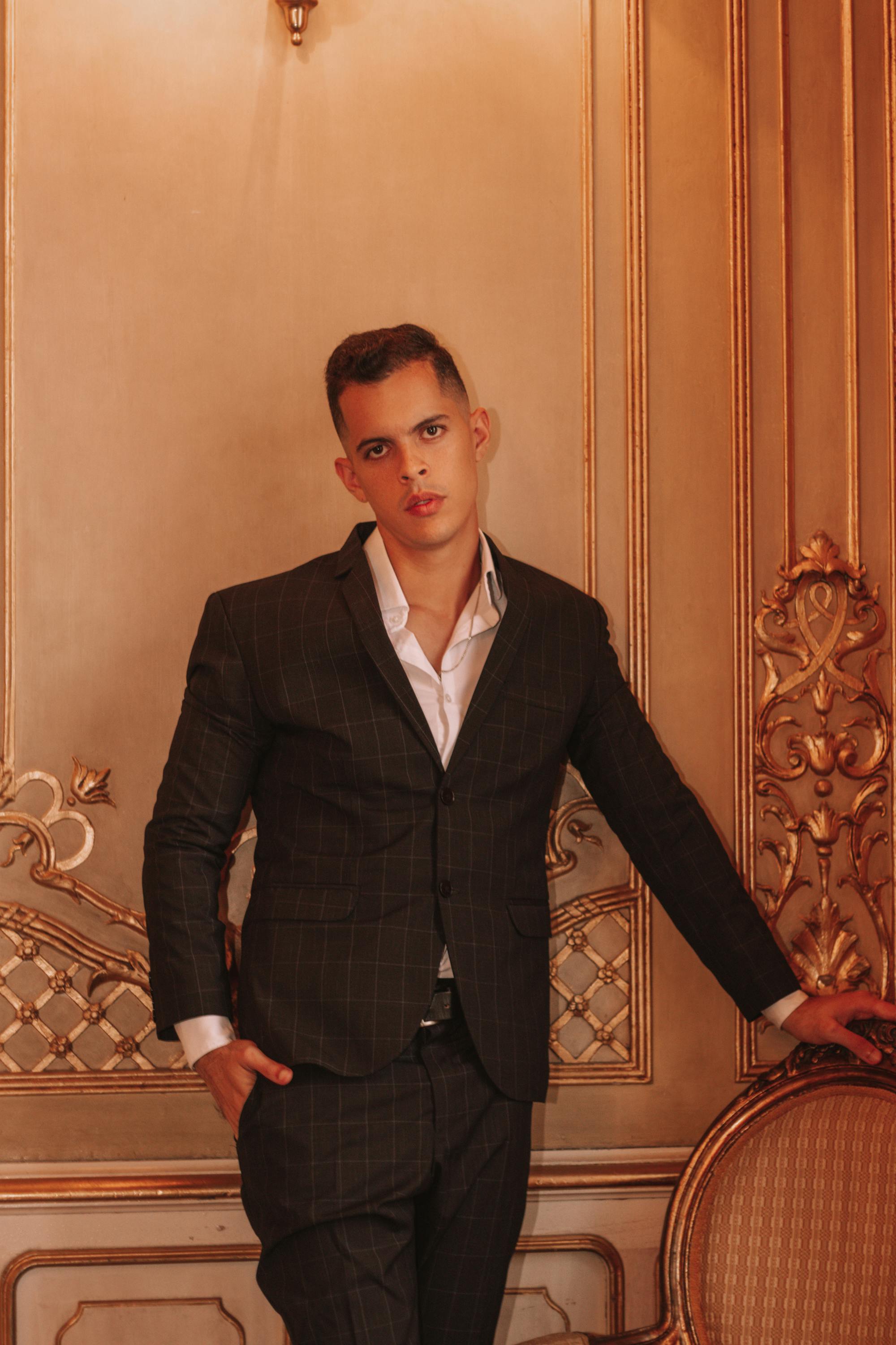 Stylish man in a striped suit posing in a luxurious interior setting, Lima, Peru.