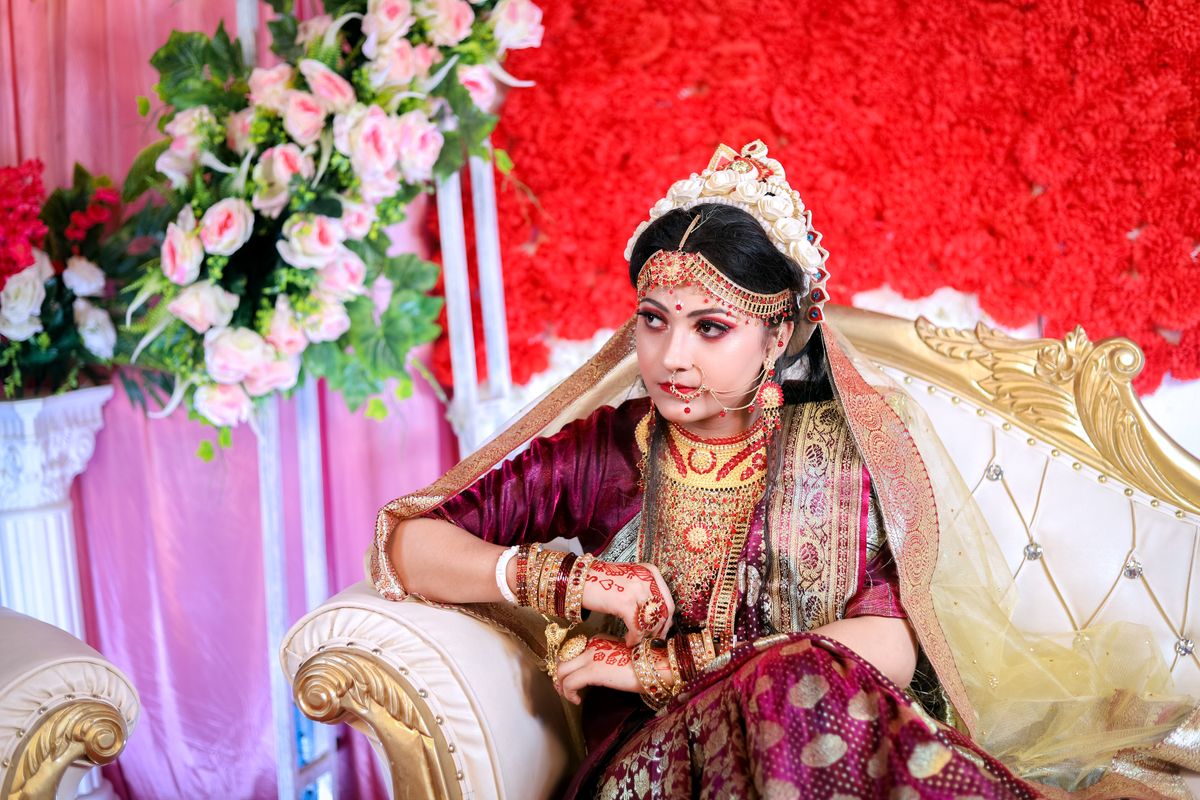 Pretty Women in Traditional Dress Sitting on a Sofa · Free Stock Photo