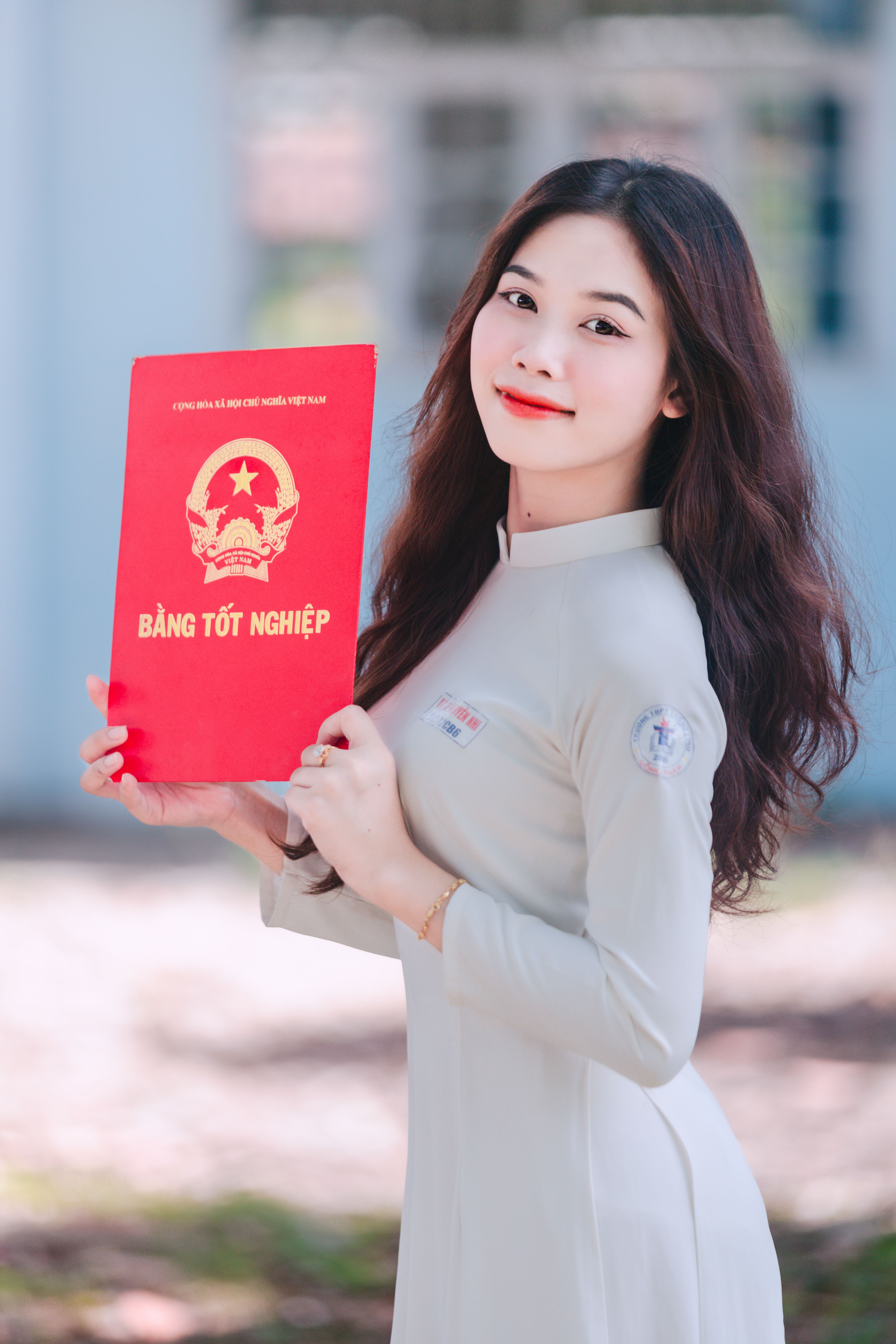 Pretty Brunette Wearing a White Dress Holding a Red Diploma · Free ...