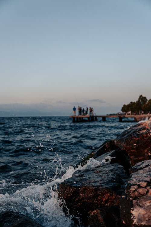 açık hava, balıkçı, deniz içeren Ücretsiz stok fotoğraf