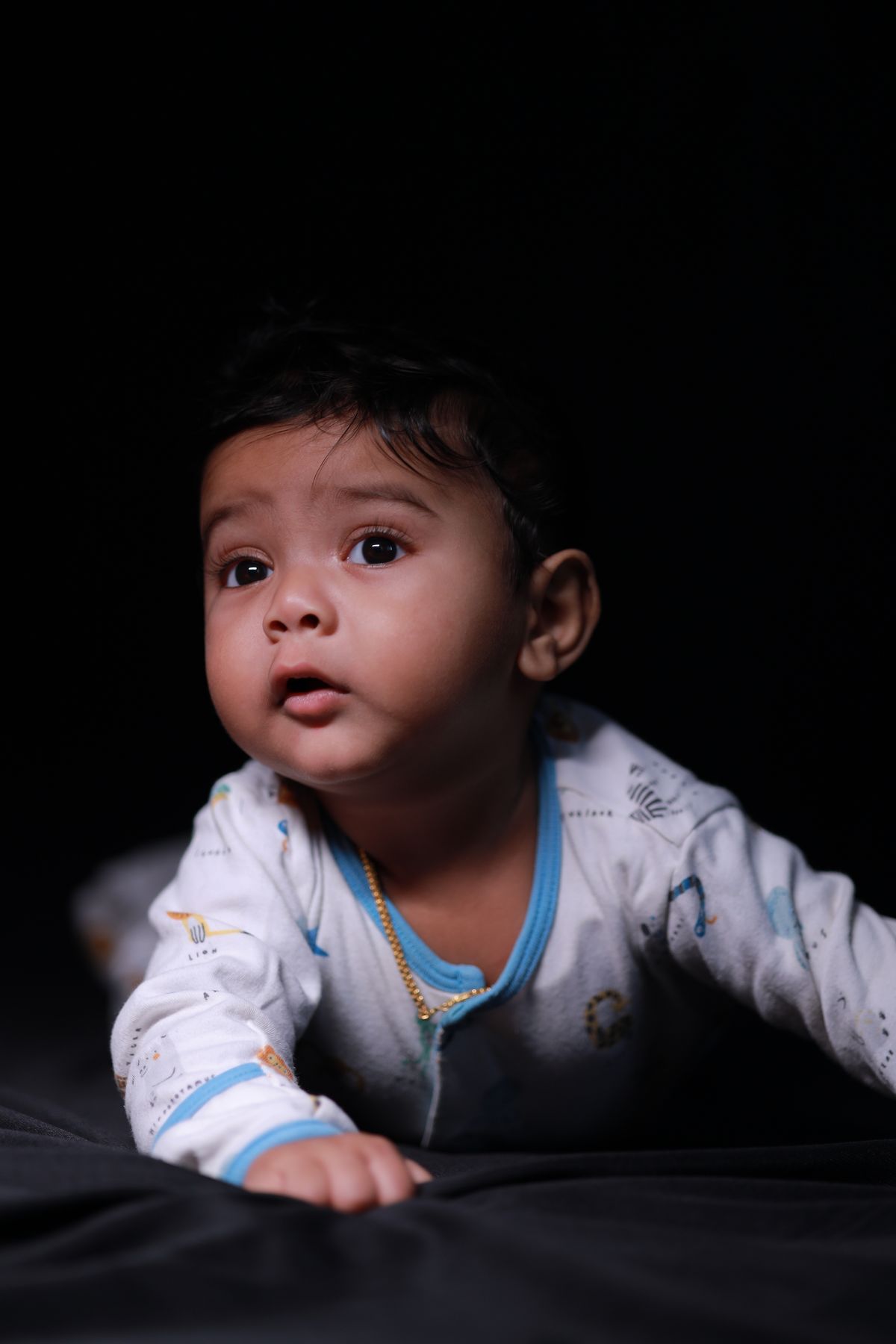 Baby in pajamas crawling