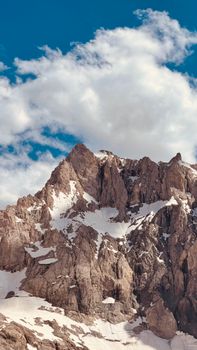 Explore the serene beauty of Hakkâri's impressive snow-covered mountain peaks under a vibrant blue sky.