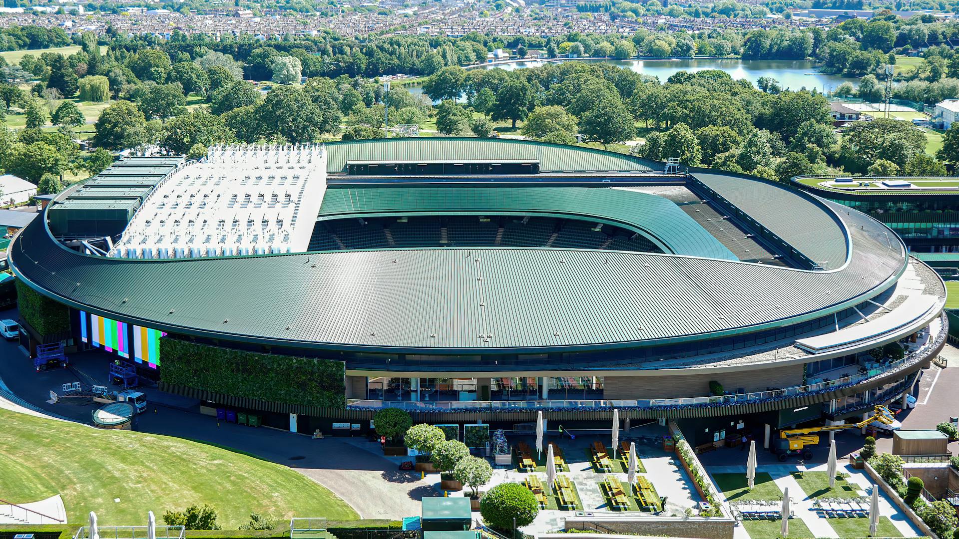 Arial shot of the iconic Wimbledon tennis stadium in the summer.