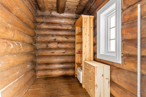 A cabin with wooden walls and a window