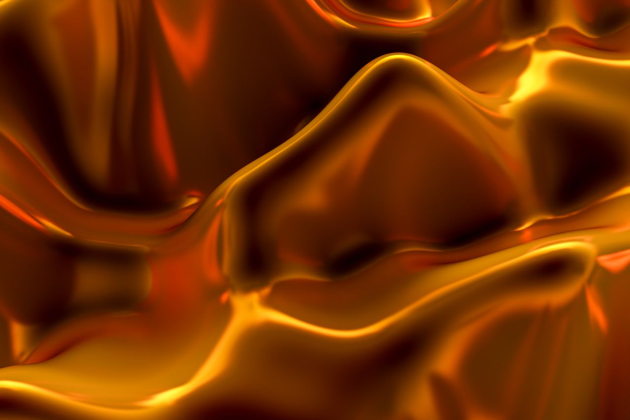 vibrant abstract golden texture resembling fluid or liquid metal art