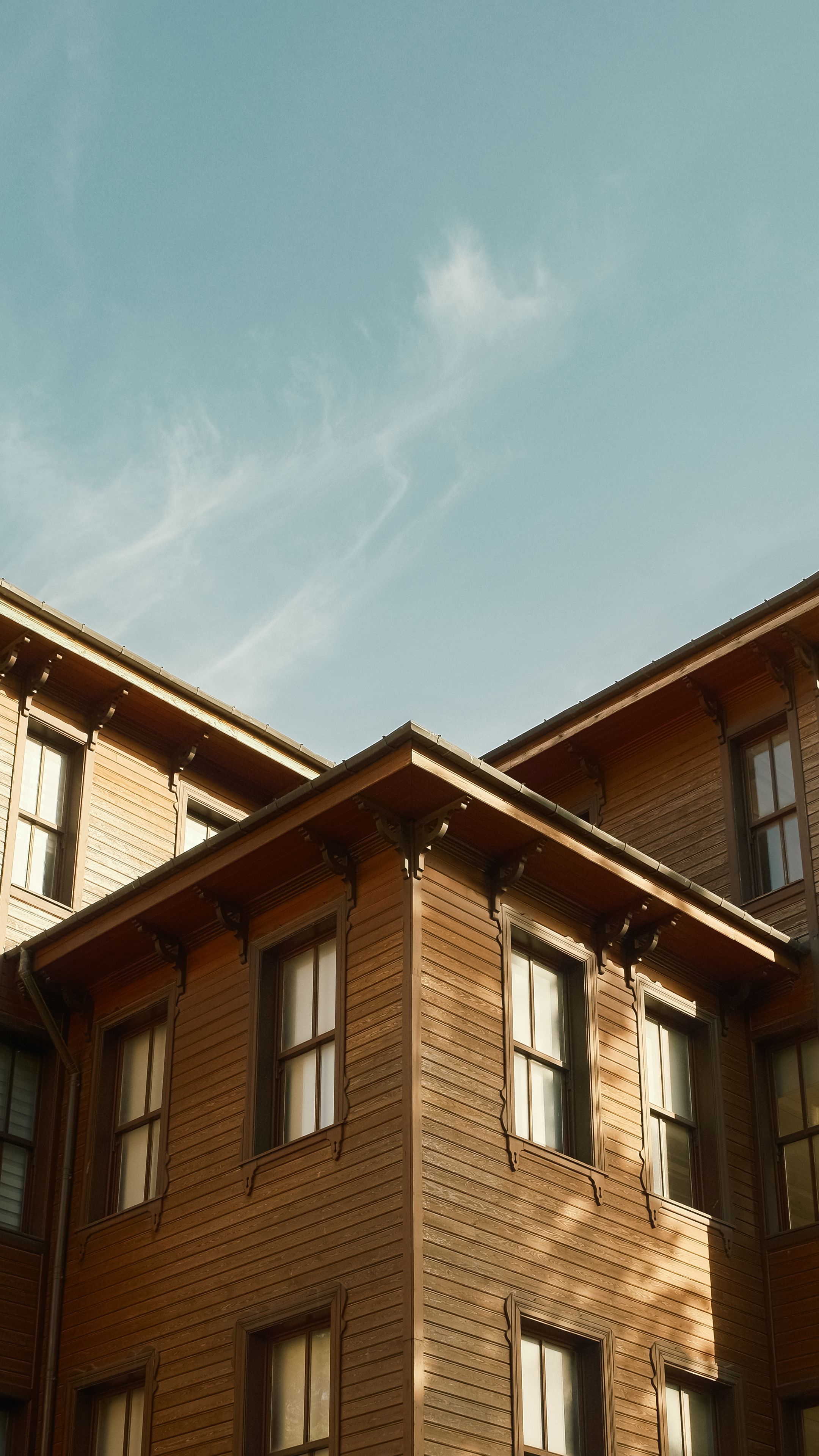 The painted timber exterior and window trim of a building