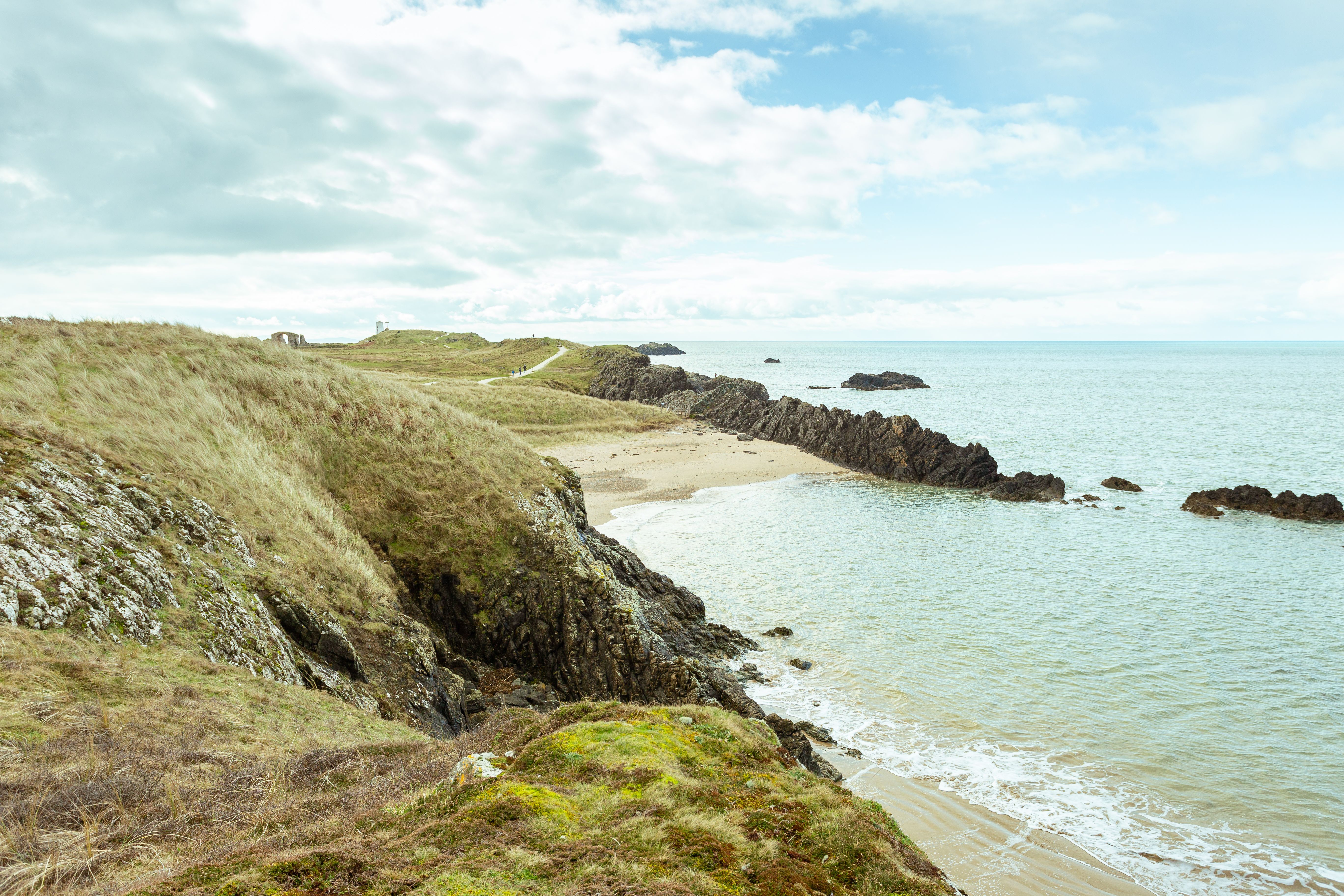 Calm coastline with green headlands