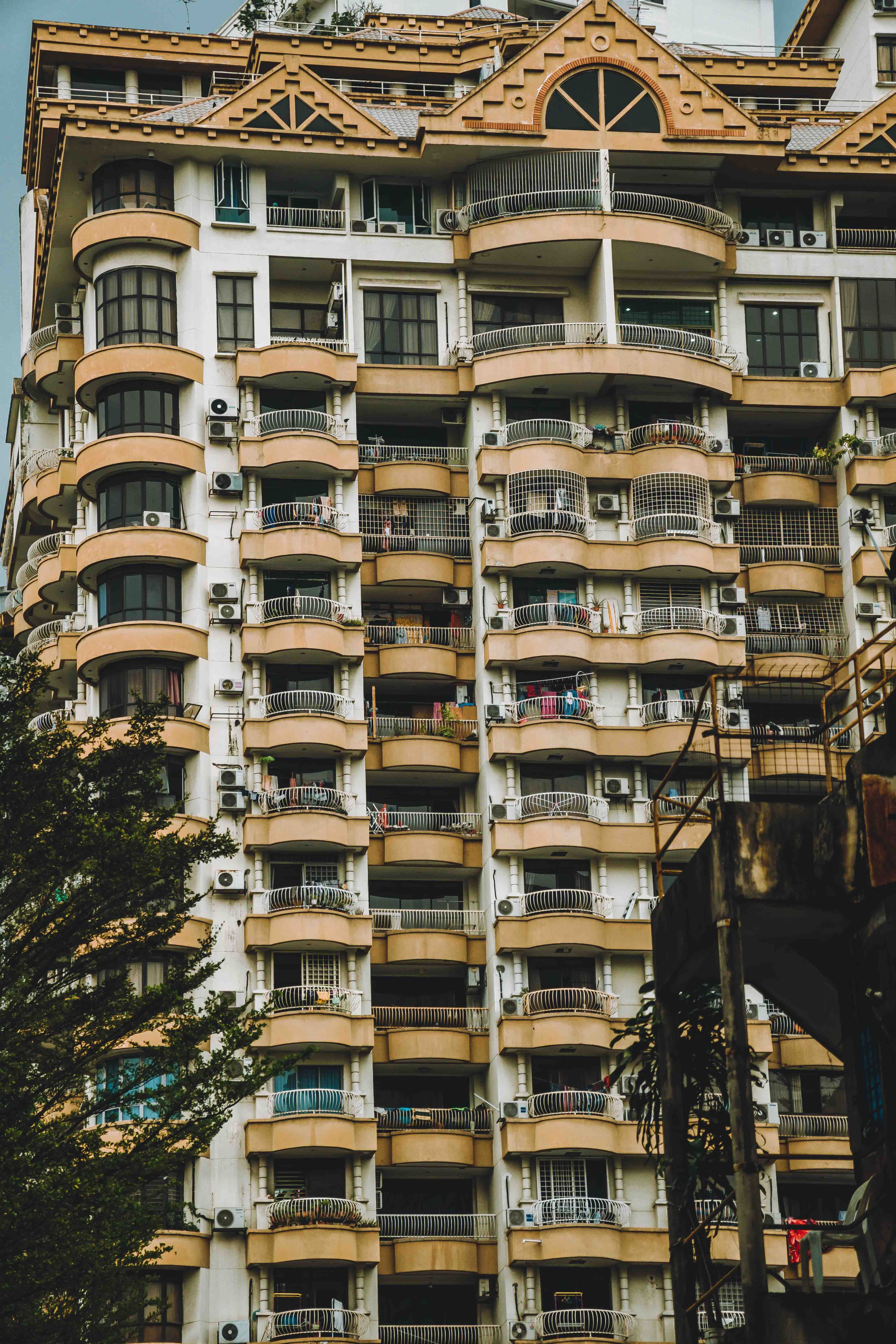 A tall building with balconies and windows · Free Stock Photo