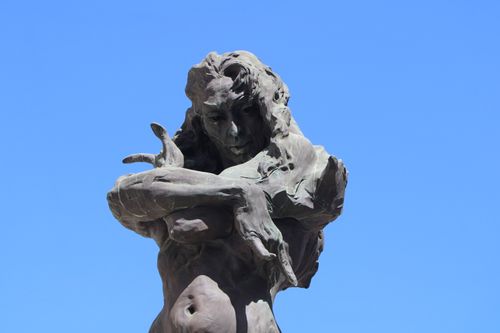 Free Striking bronze sculpture against a clear blue sky in Jerez de la Frontera, Spain. Stock Photo