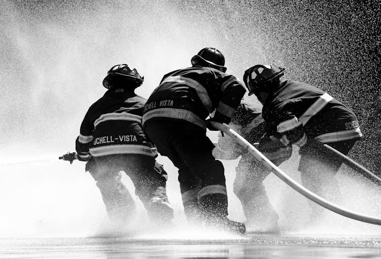 Grayscale Photo Of Firemen