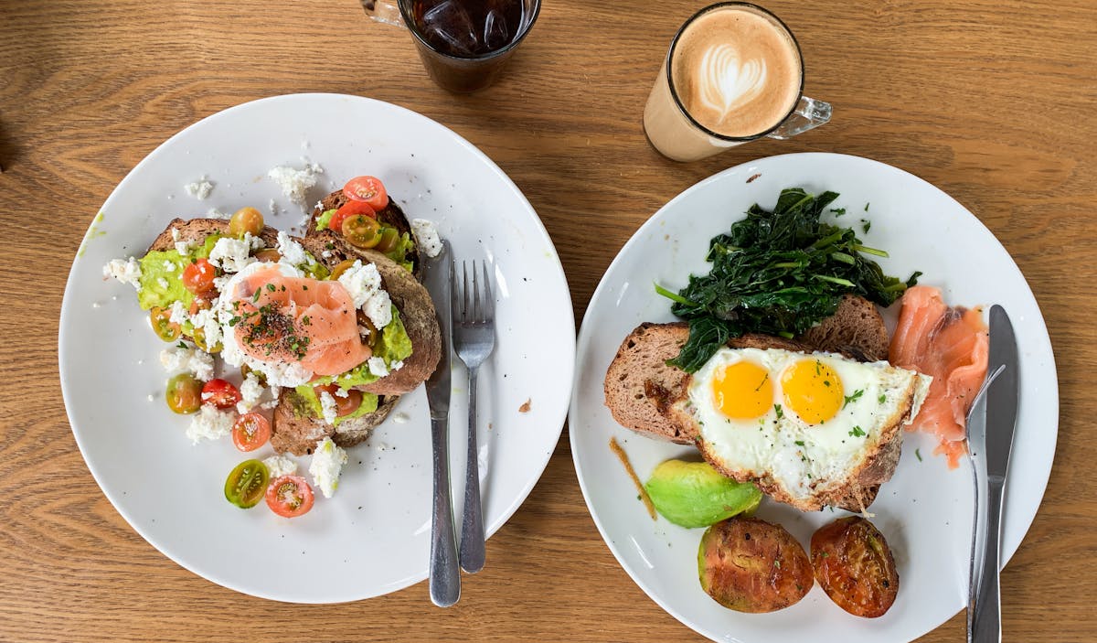 Colorful macro-friendly burrito bowls with chicken, rice, beans, and fresh vegetables