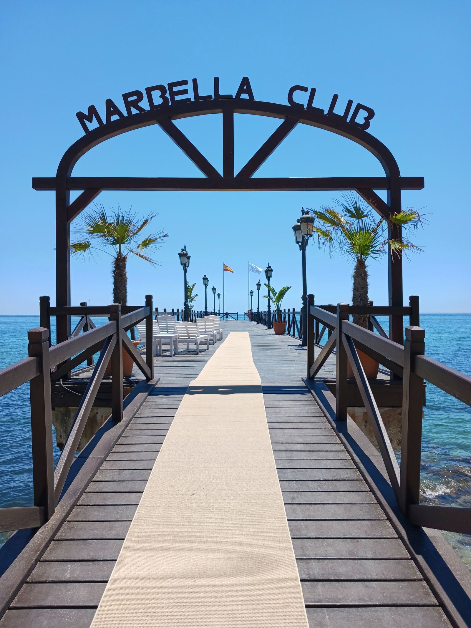Marbella Club pier extending over calm blue sea