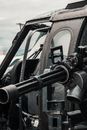 Close-up Photo of Black Helicopter With Black Machine Gun
