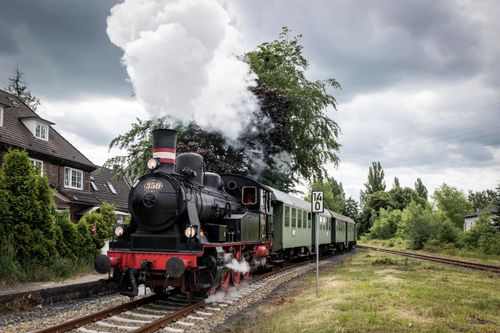 Free Vintage steam locomotive in rural Geesthacht, Germany, on a cloudy day. Stock Photo