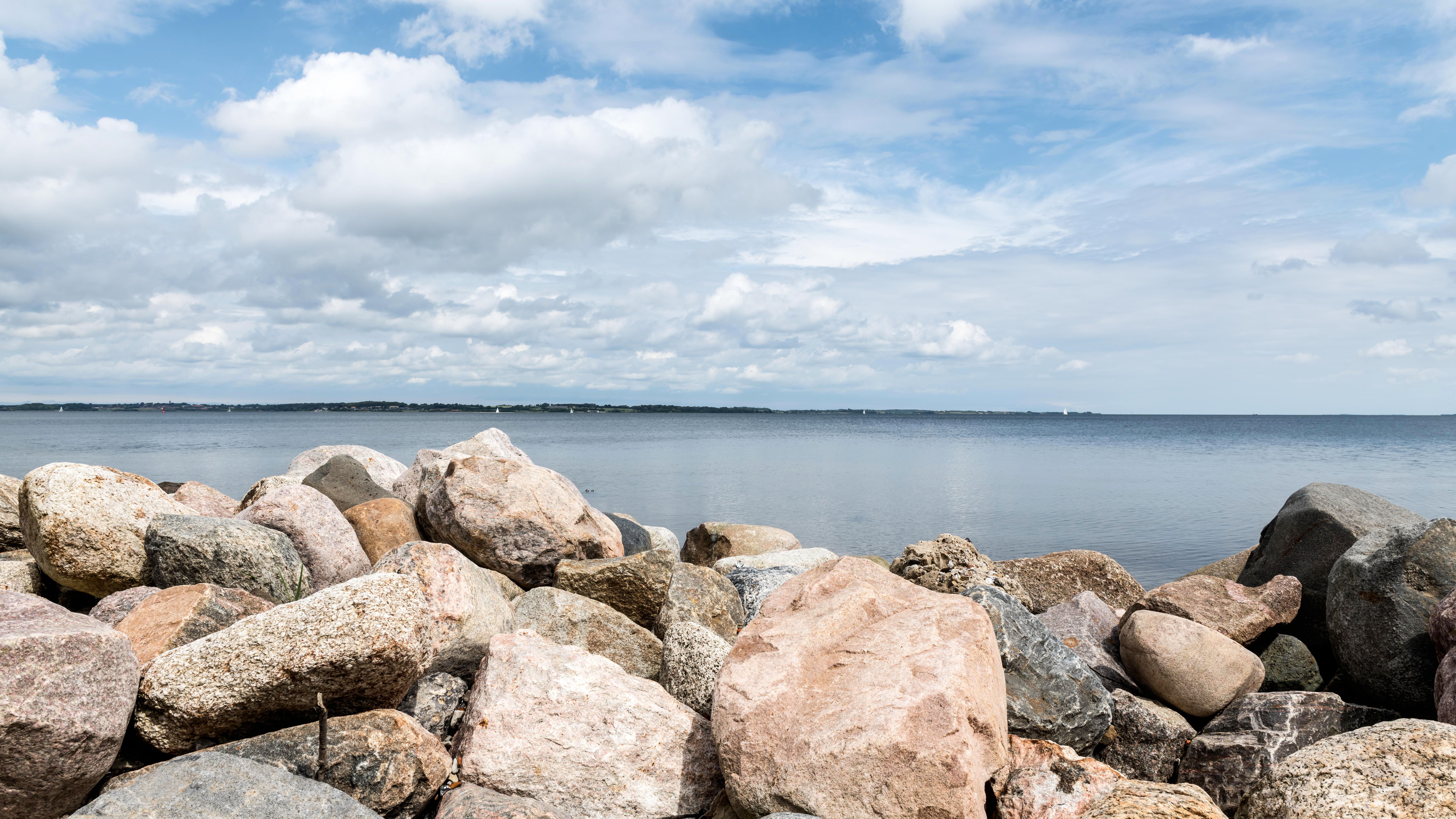 Beach Covered in Big Rocks and the Sea · Free Stock Photo