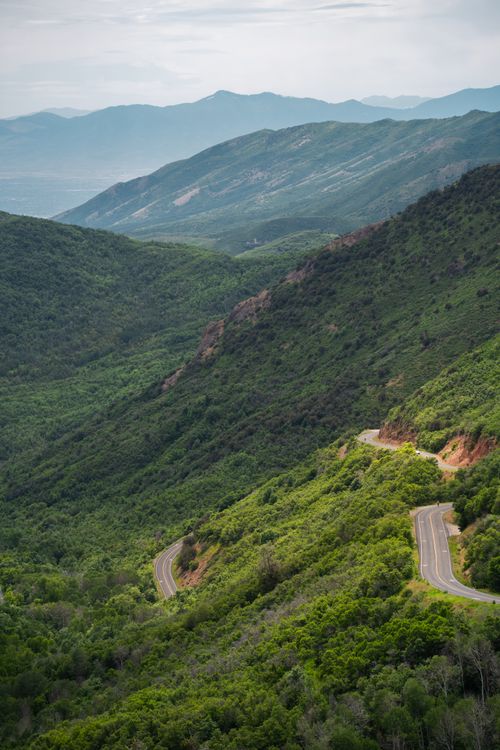 Free A stunning aerial view of a winding road through lush green mountains near Salt Lake City, Utah. Stock Photo