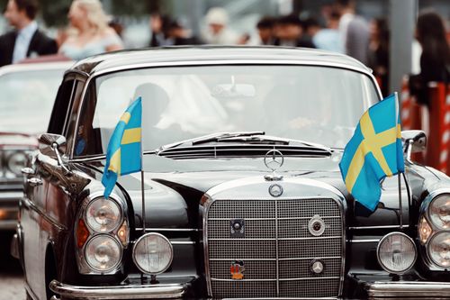 Free Vintage Mercedes-Benz car with Swedish flags at a show in Jönköping, Sweden. Stock Photo