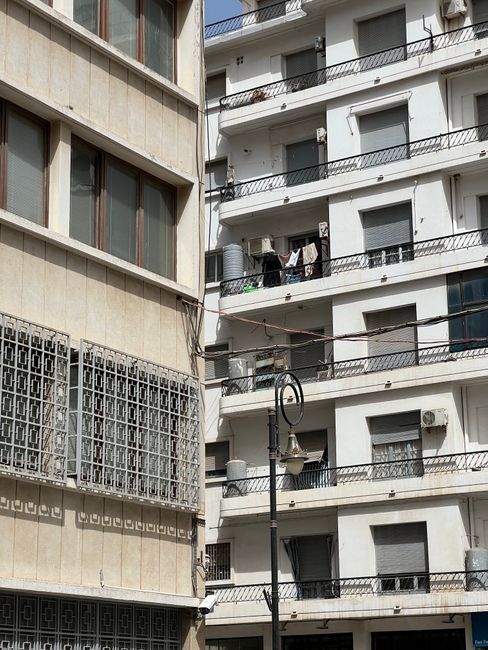 High-rise residential buildings showcasing modern urban architecture with balconies and white facades.
