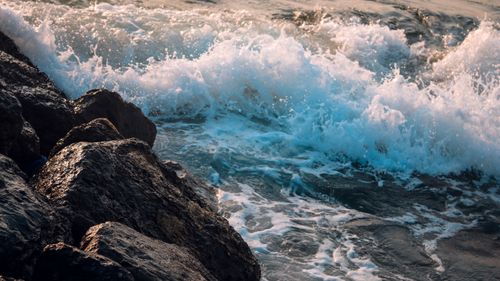 Free Captivating scene of ocean waves crashing against a rocky shoreline, creating a dramatic seascape. Stock Photo