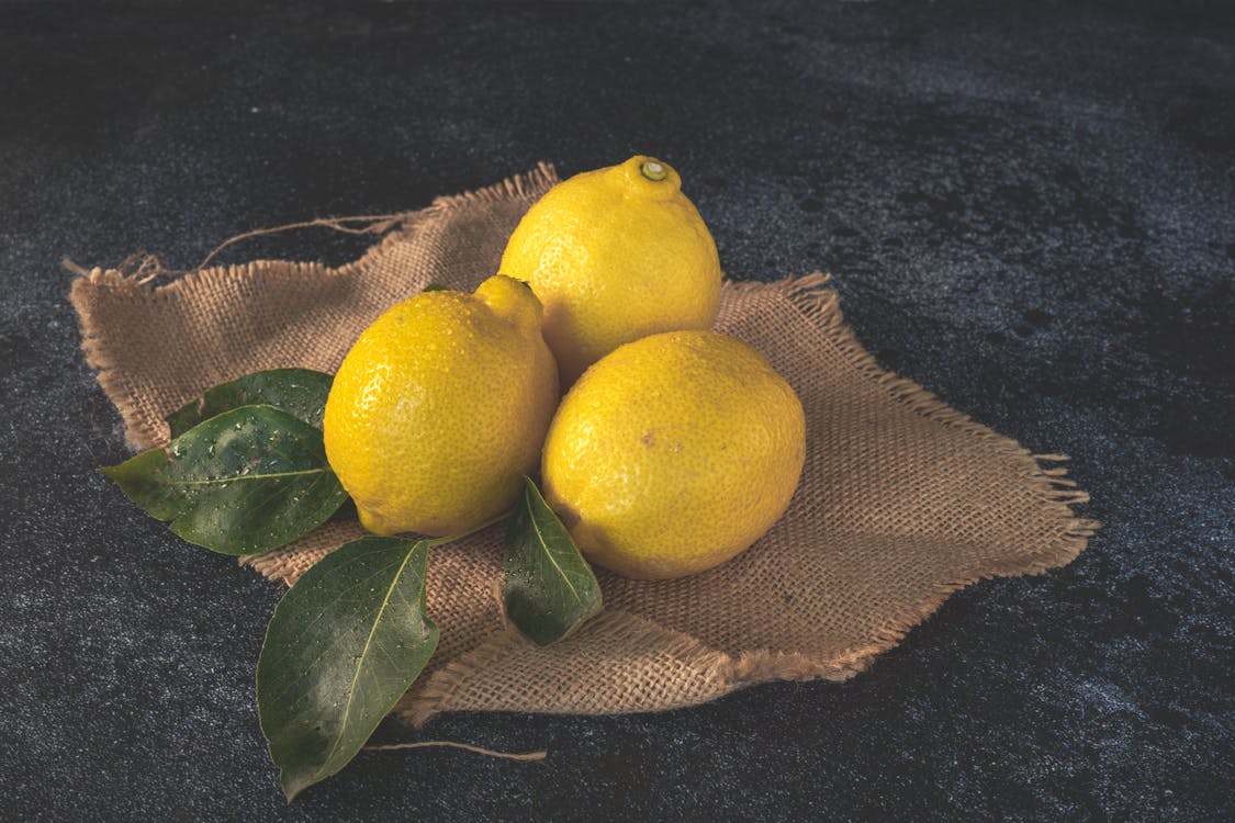 Gratis lagerfoto af blad, citron, citroner