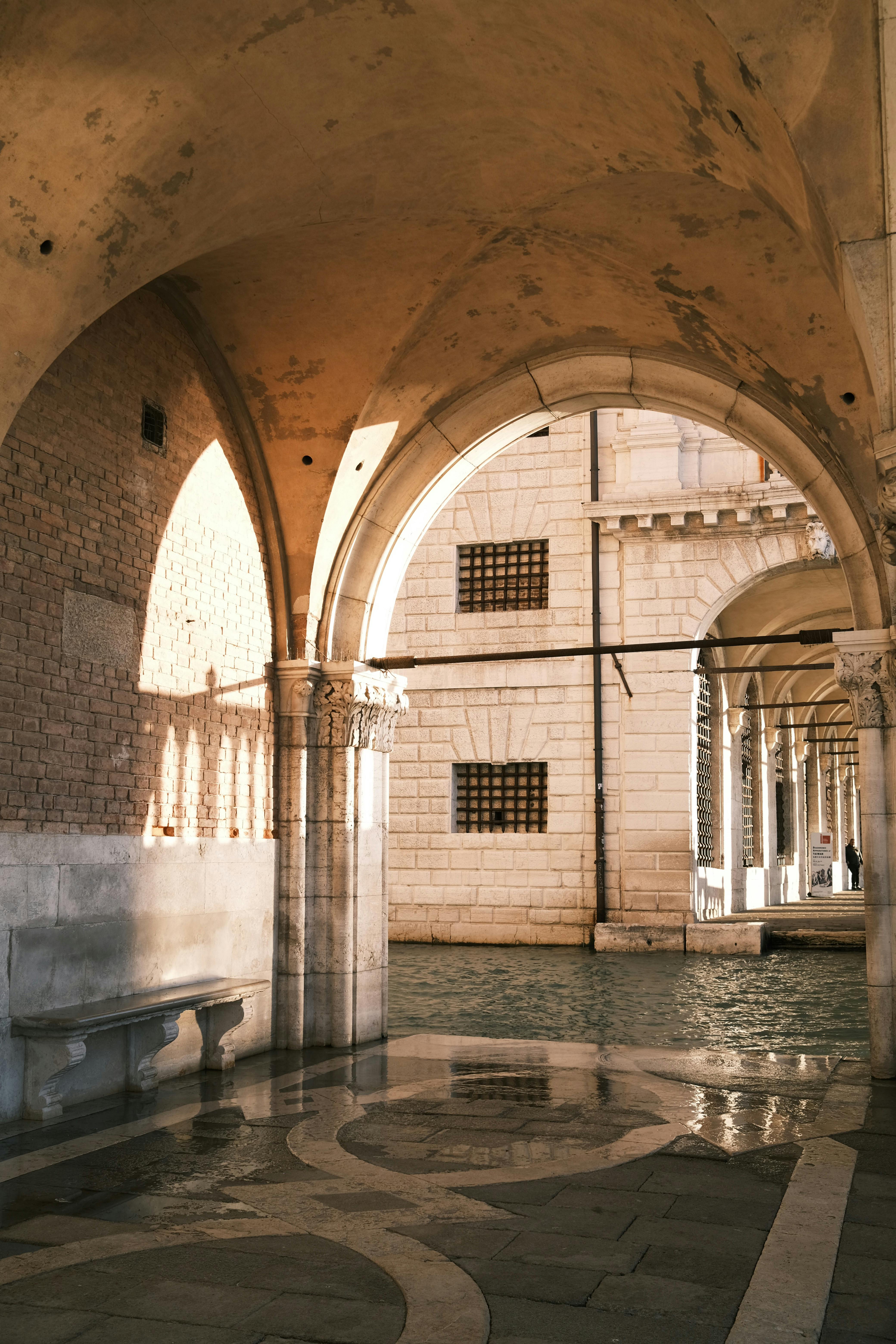 Renaissance arches inside the Doge's Palace in Venice, showcasing stunning architecture.
