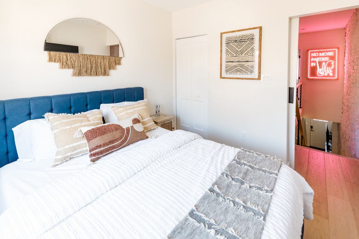 Modern hotel room with a made bed
