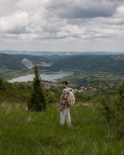 Jovan Vasiljević standing in the middle of a beautiful green valley