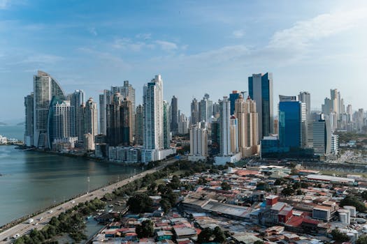 Panama City's contemporary skyline featuring skyscrapers and waterfront, captured under clear skies.