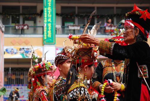 Free A vibrant display of traditional costumes during a cultural festival highlighting indigenous customs and celebrations. Stock Photo