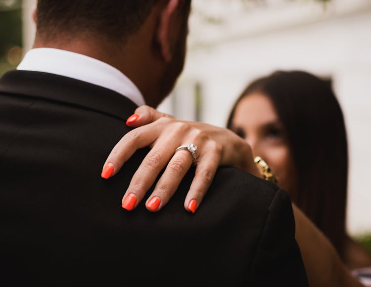 Close-Up Photo Of Woman's Hand With Diamond Ring