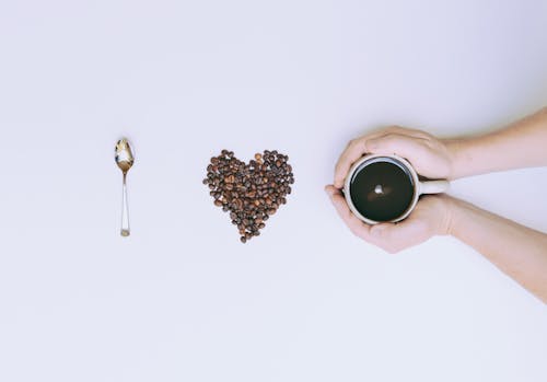 Fotografia Piatta Della Tazza E Del Chicco Di Caffè