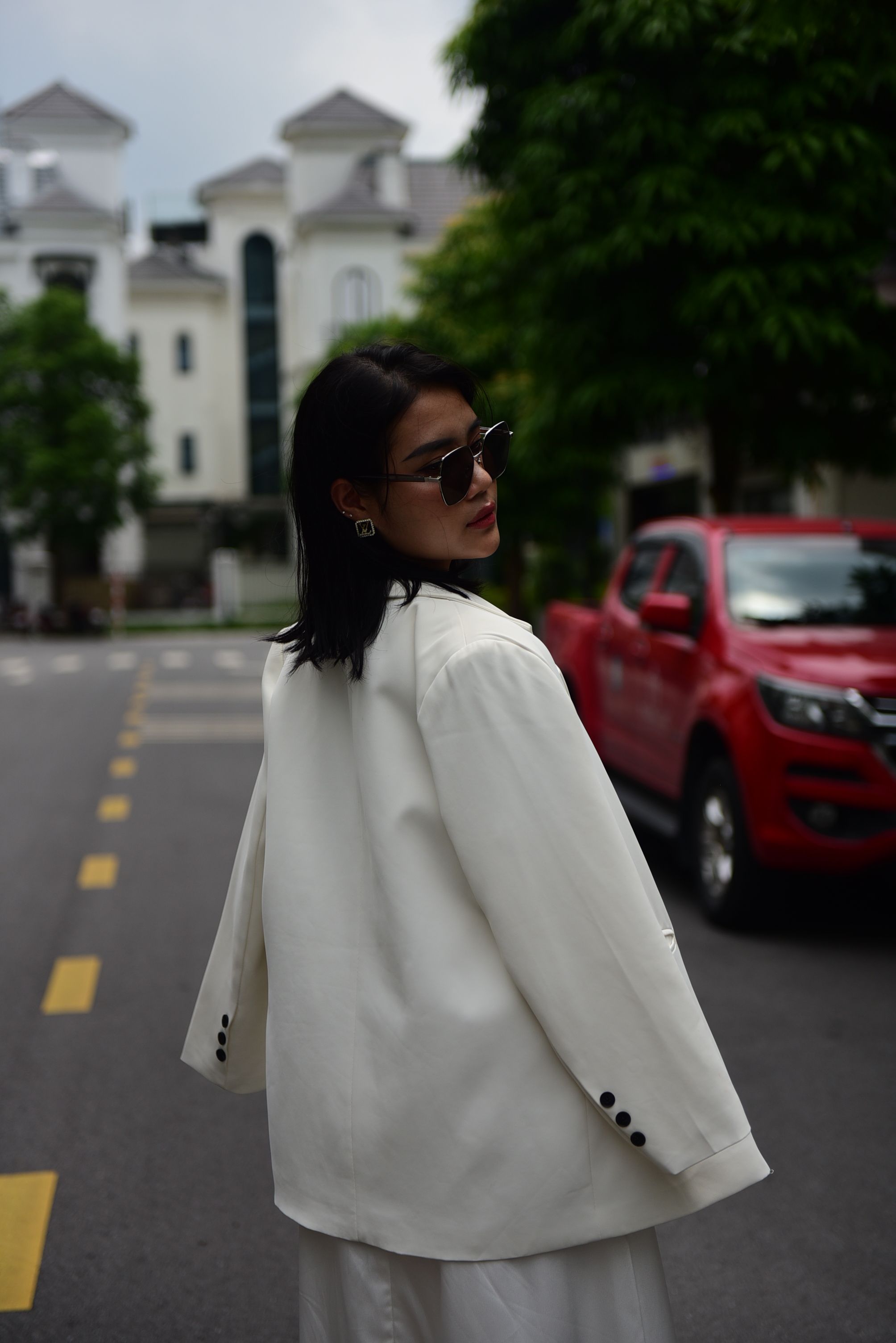 A Fashionable Woman Standing on the Street · Free Stock Photo