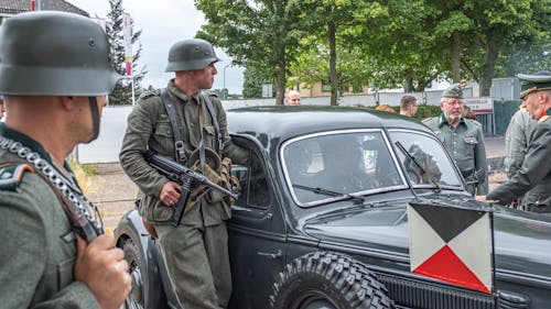 Soldier Near Concrete Pillars Holding Semi Automatic Gun With Scope ...