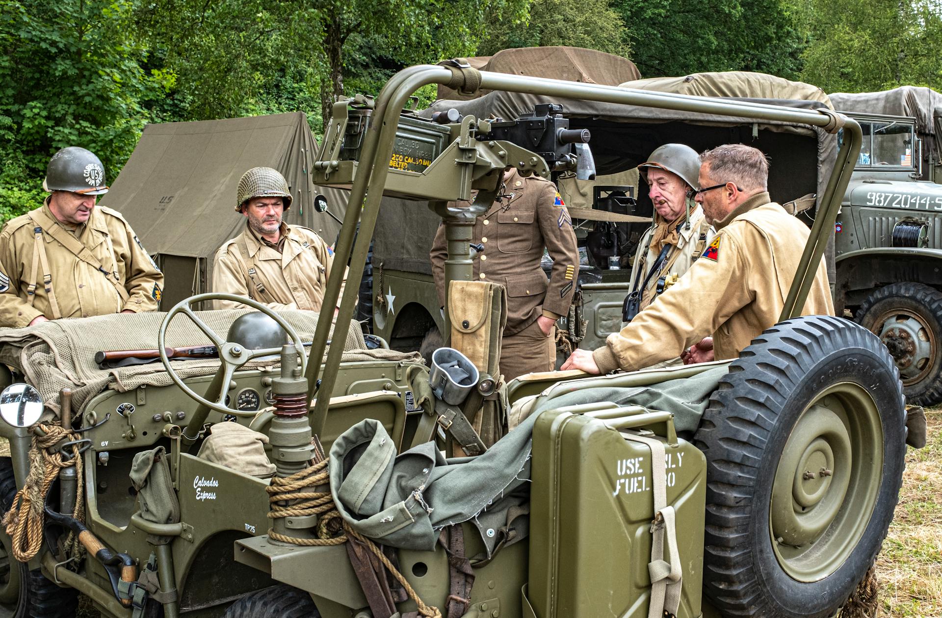 Photo of Soldiers Standing Near Military Vehicle