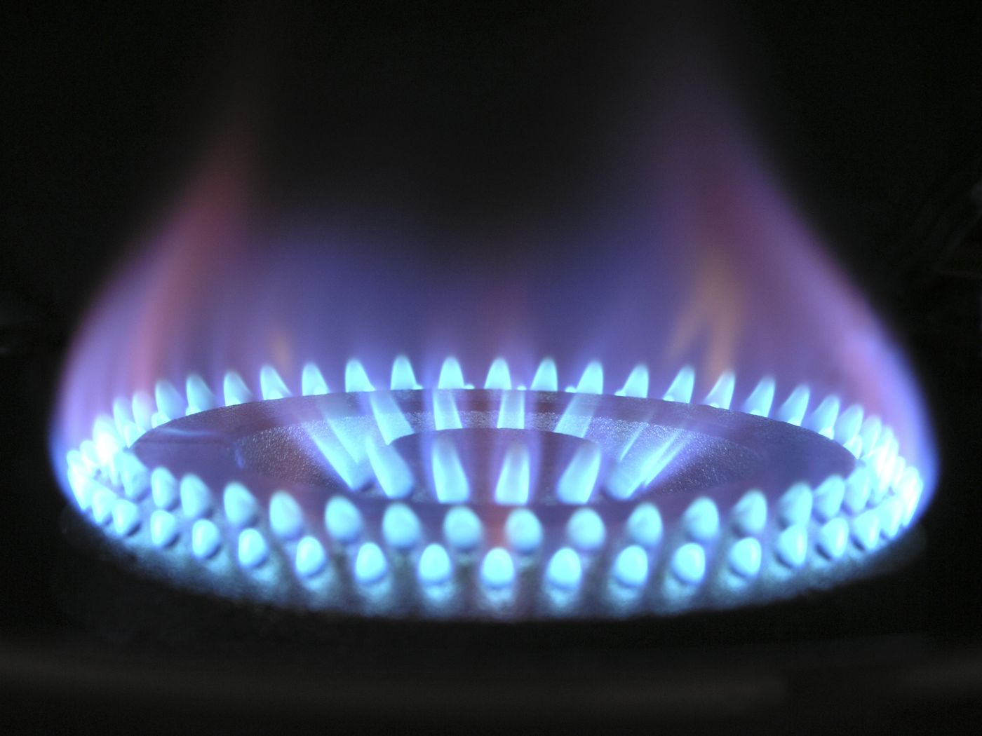 Blue flame of a gas burner, the fuel behind the spark spread