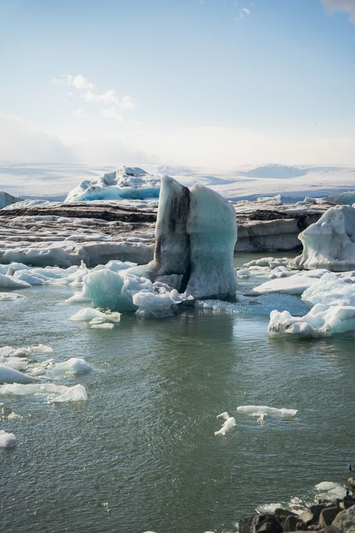 Free Magnificent iceberg surrounded by frozen waters in a pristine winter landscape. Stock Photo