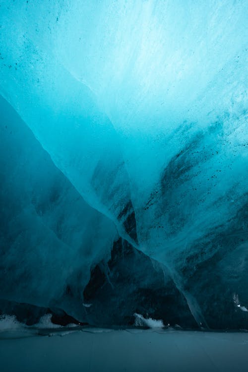 Free A blue ice cave with a blue sky Stock Photo