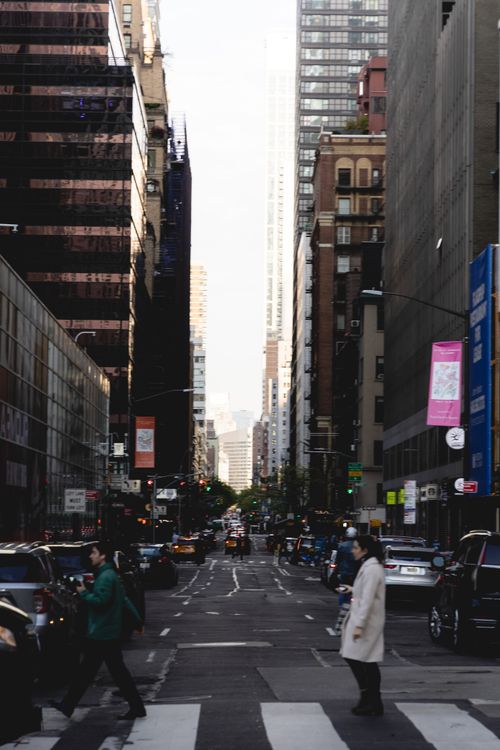 Free A bustling street scene in Midtown Manhattan with pedestrians and skyscrapers. Stock Photo
