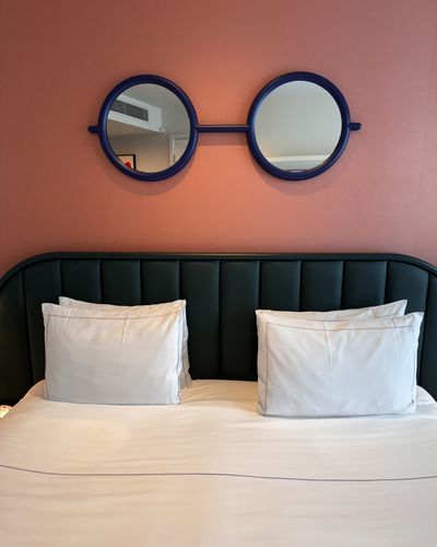 Contemporary bedroom interior with a circular headboard feature — Ben Prater on Pexels