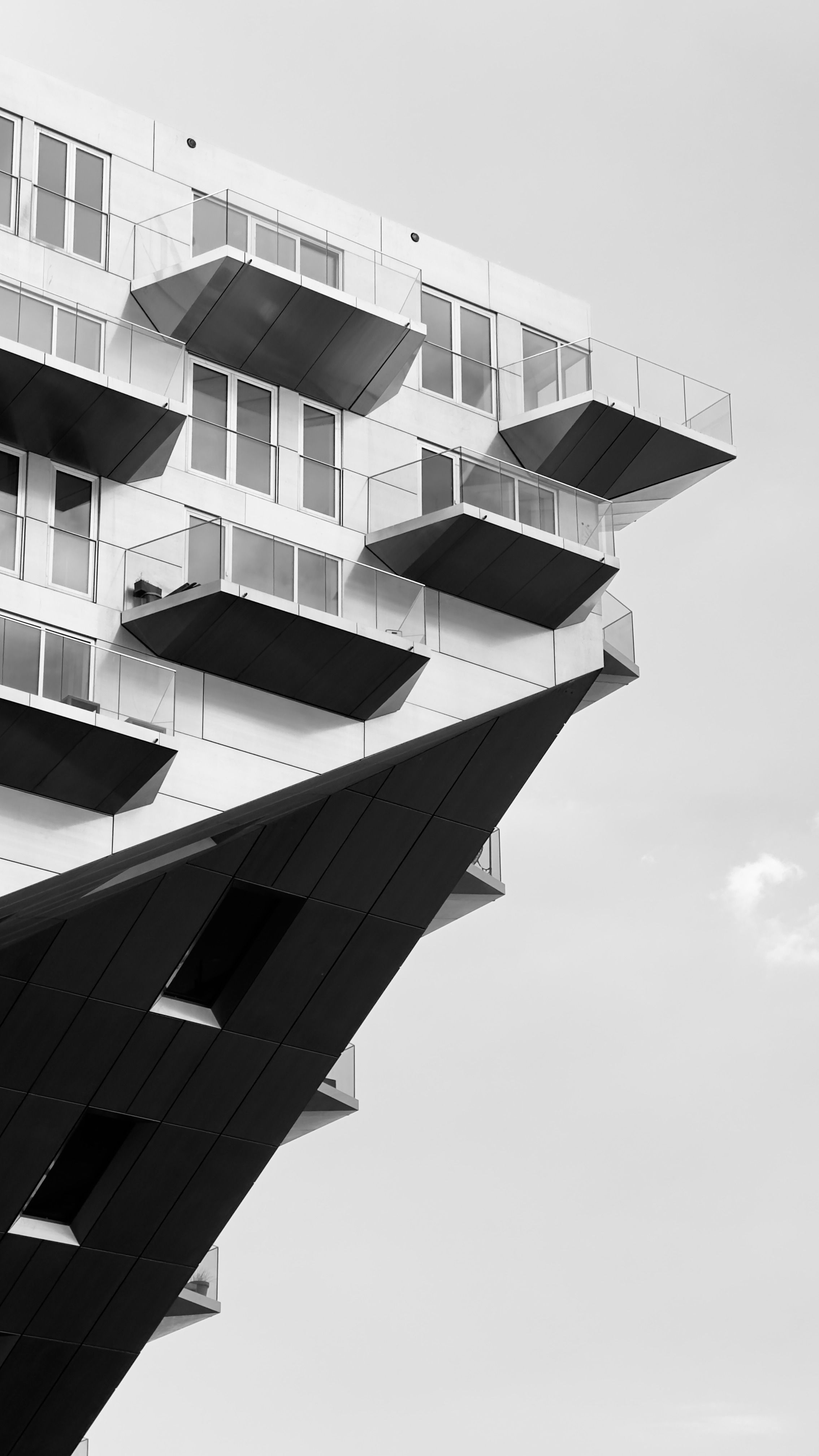 Black and white photograph of a building with balconies · Free Stock Photo