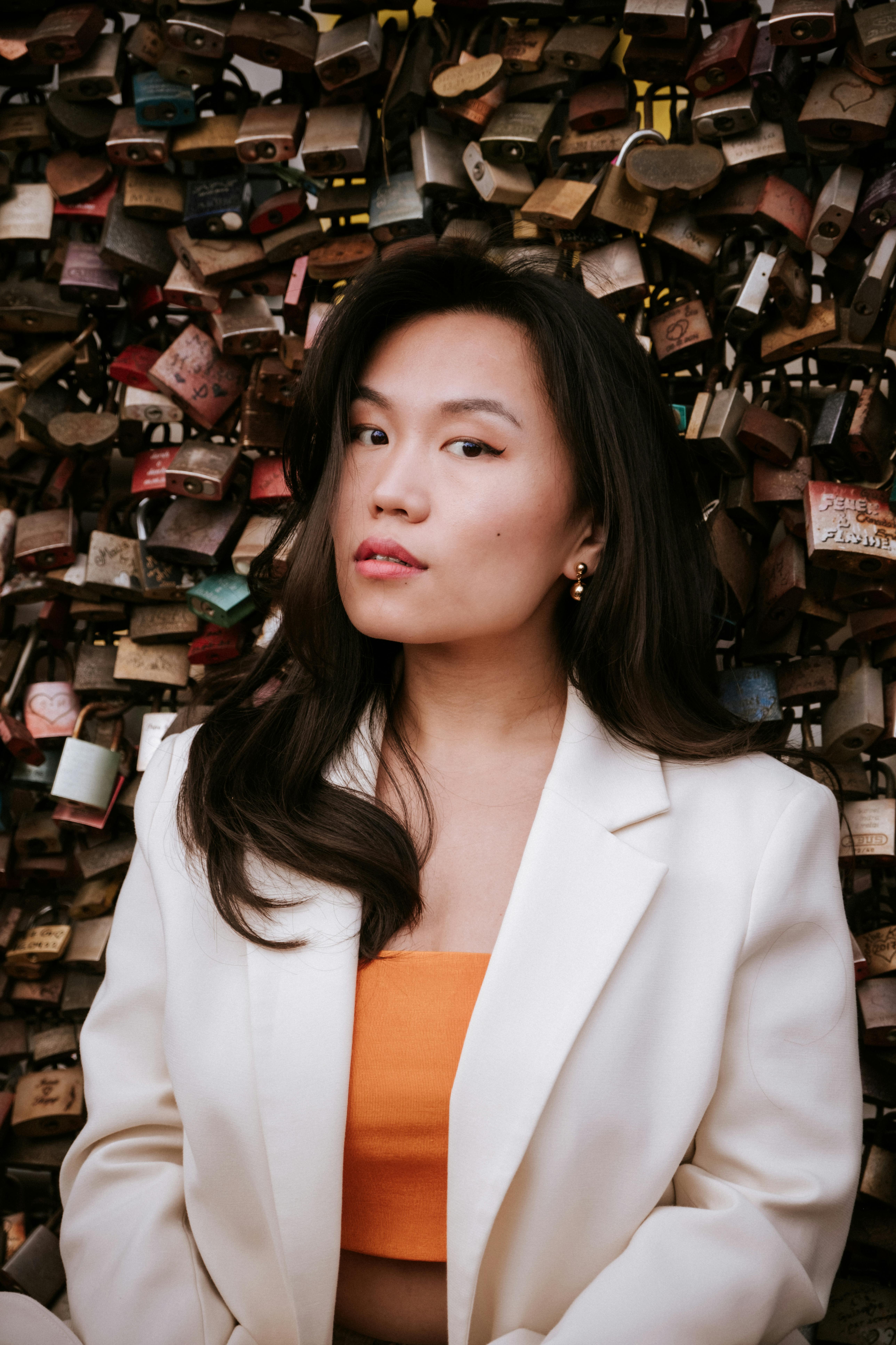 Fashionable portrait of a woman in Cologne, Germany with love locks in the background.