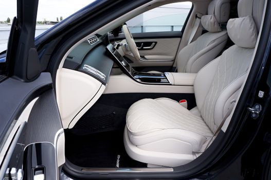 Explore the luxurious design of a modern Mercedes car interior, featuring elegant leather seating and advanced technology.