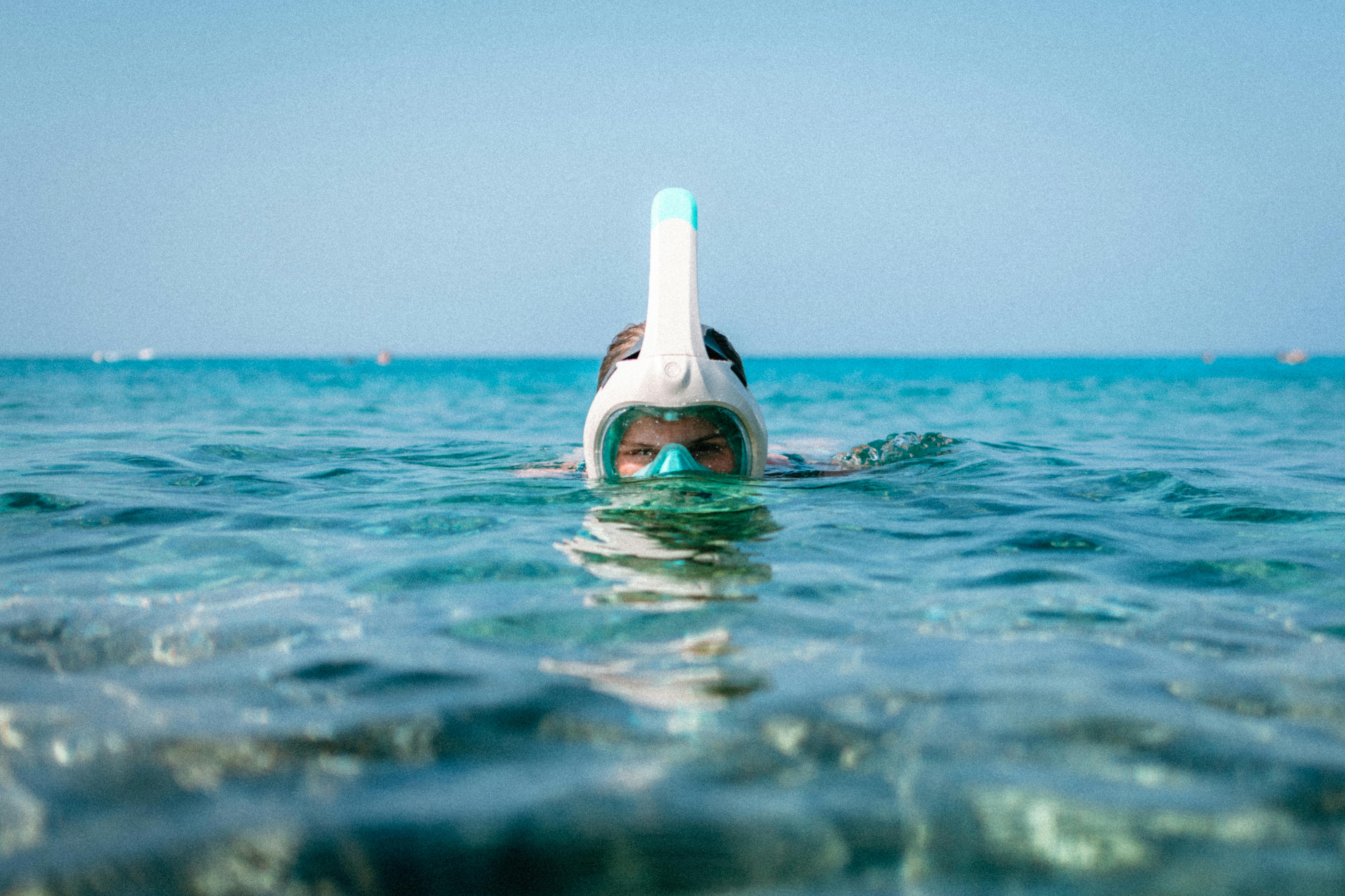 A person in the water with a snorkel