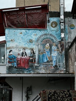 Vibrant mural on a cafe wall in Istanbul showcasing city culture and art.