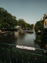 River behind Railing of Museumbrug Bridge in Amsterdam