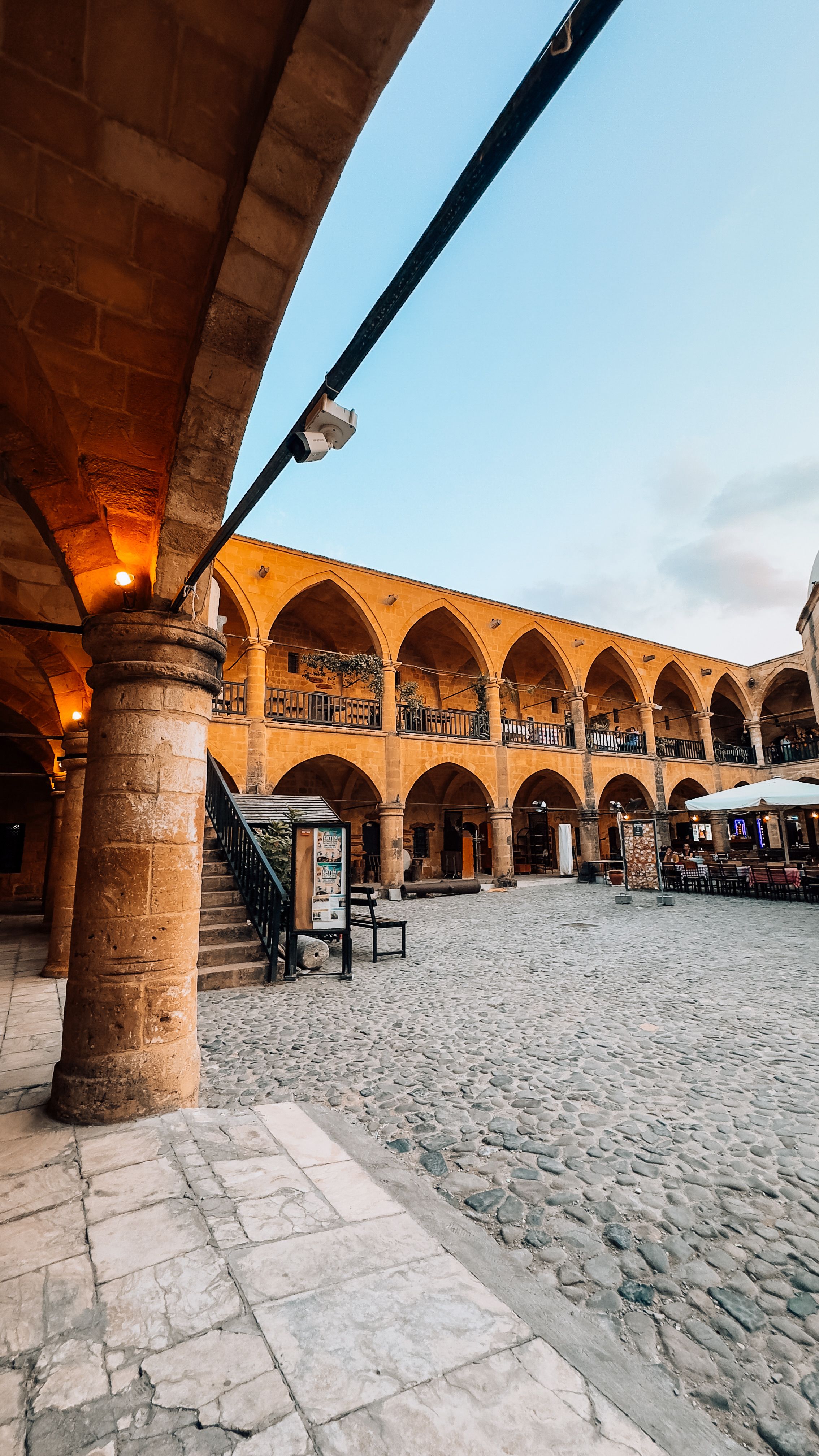 Explore the historic Buyuk Han courtyard, a stunning landmark in Cyprus with traditional architecture.