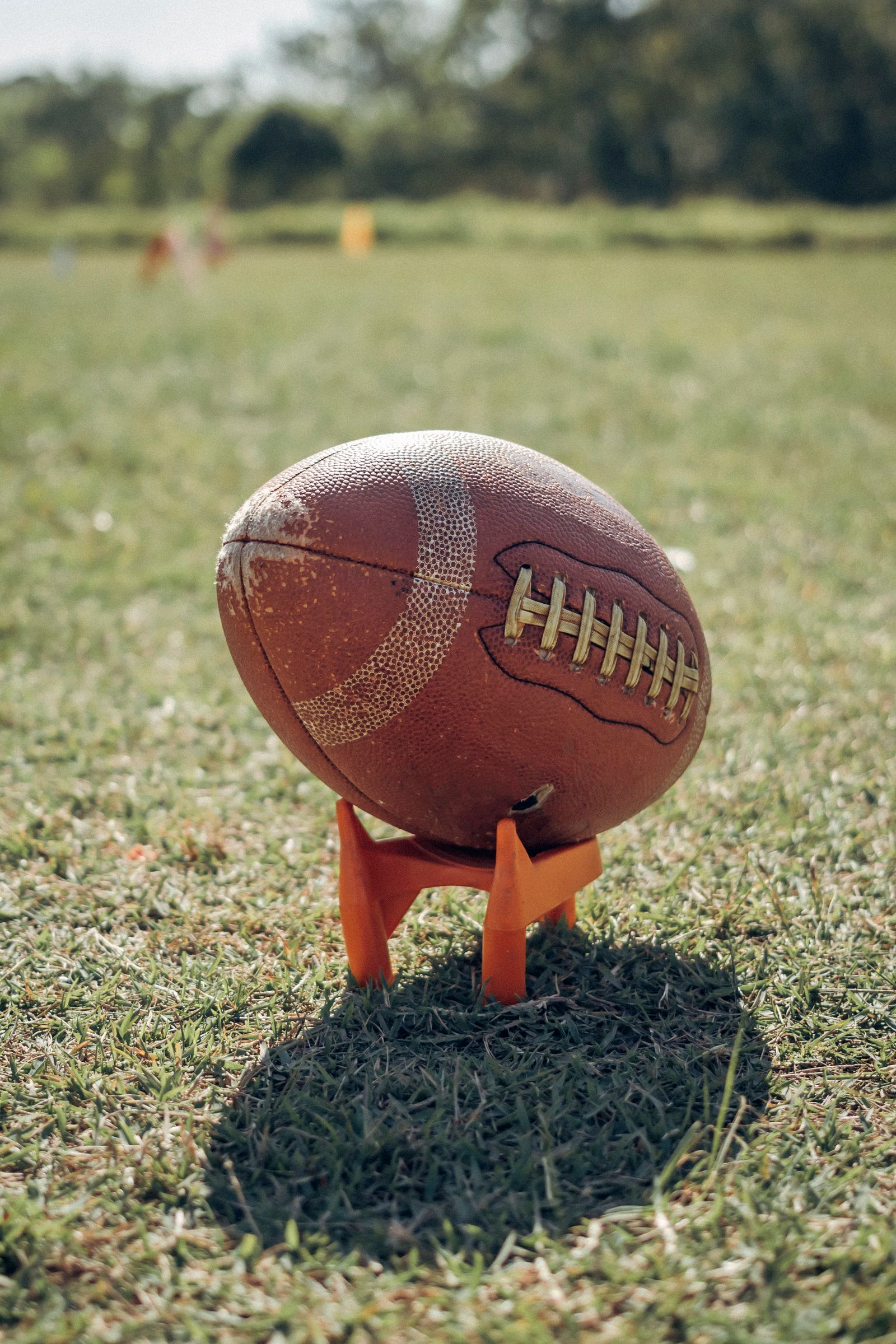 Close-up of an American football on a grass field