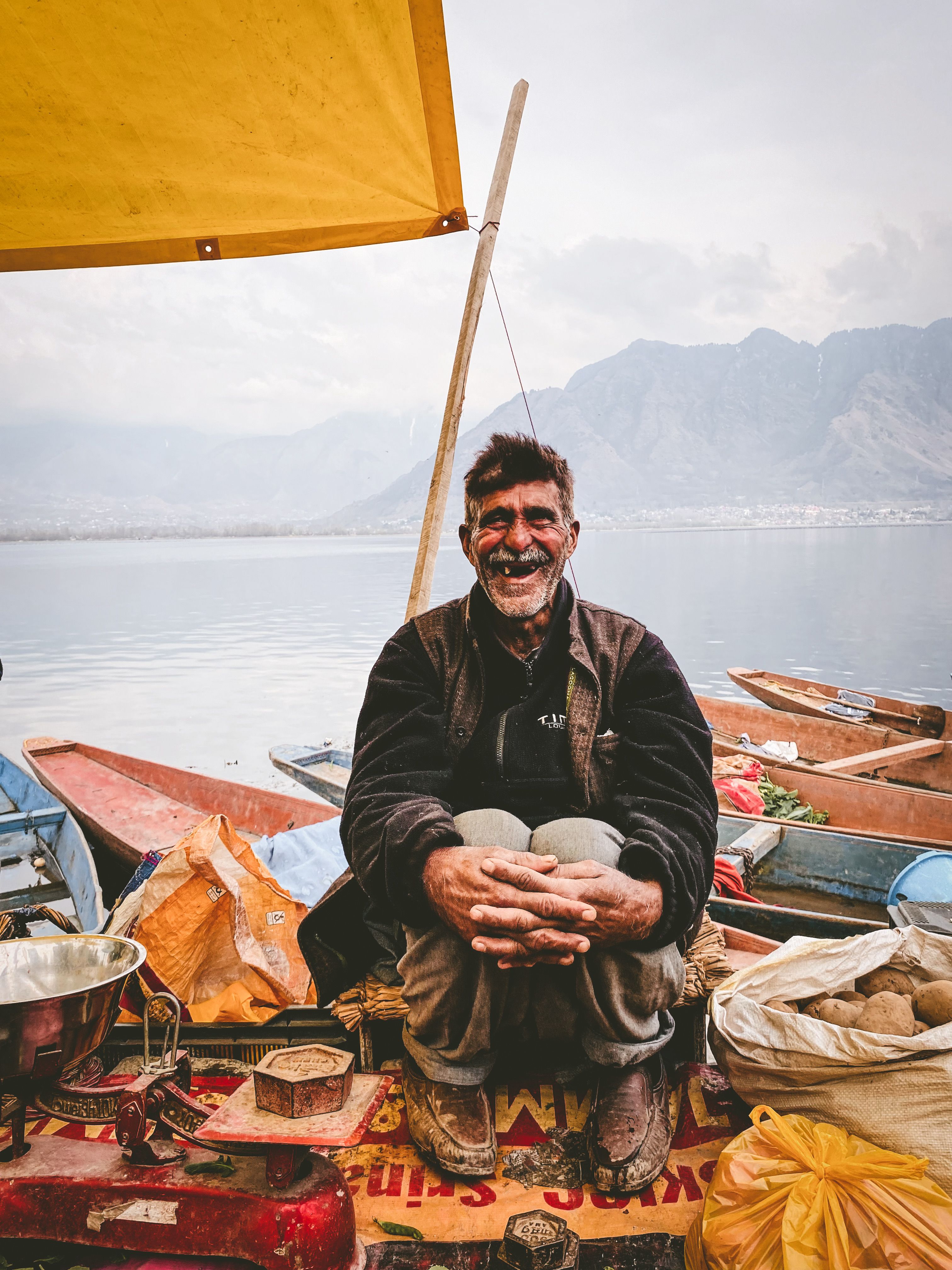 Elderly Man Sitting By the Sea · Free Stock Photo