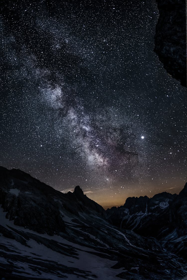 Photo Of Mountain Under Starry Night Sky